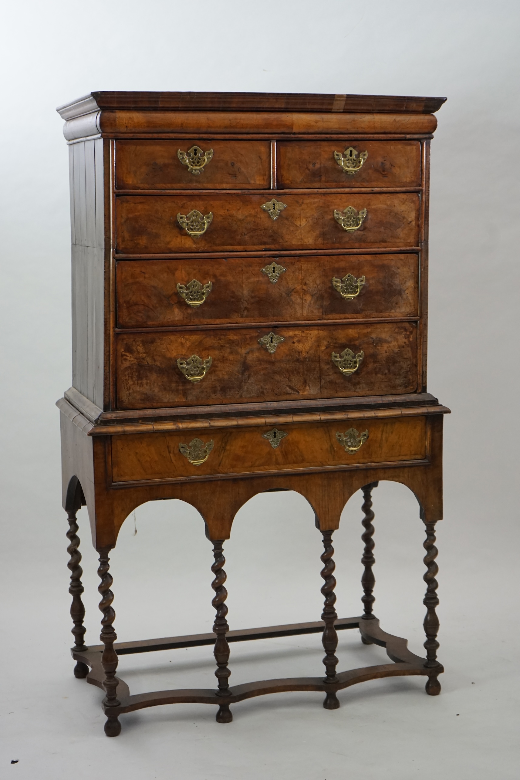 An early 18th century walnut chest on stand